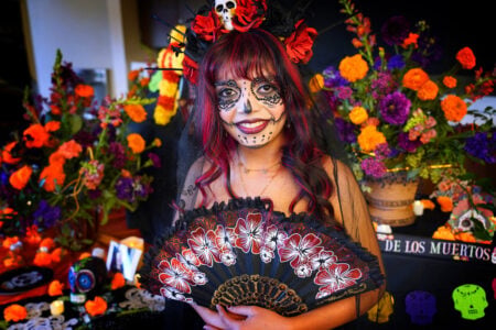 A student dressed in Day of the Dead costume.