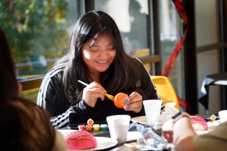 Student painting during a student activities event.