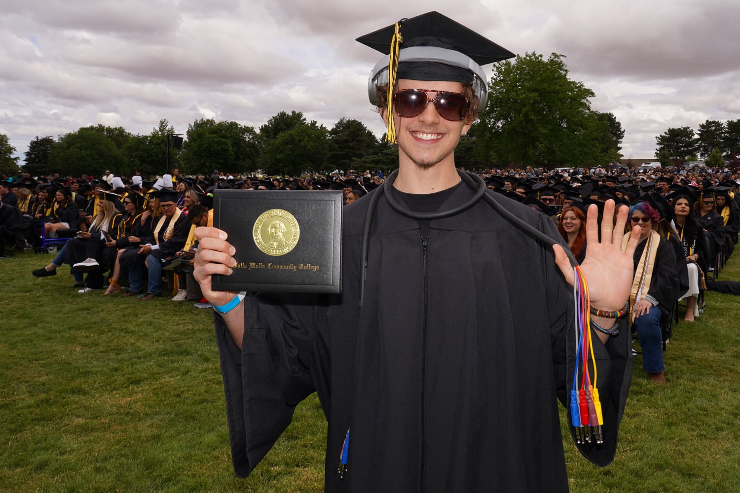 Audio engineering student in graduation gown.