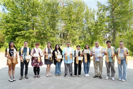 Honor students holding awards.