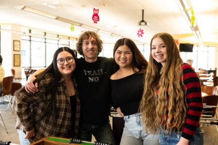 Running Start group of students smiling standing in the Student Activity Center