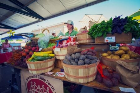 image of person selling at a farmer's market
