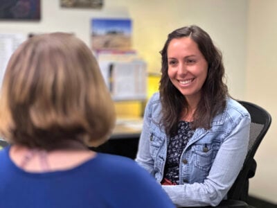Navigator speaking to a student.