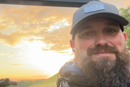 webb smiling with the sunset in the background.